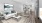 a living room with a white couch and a table