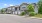 a large house with trees and bushes
