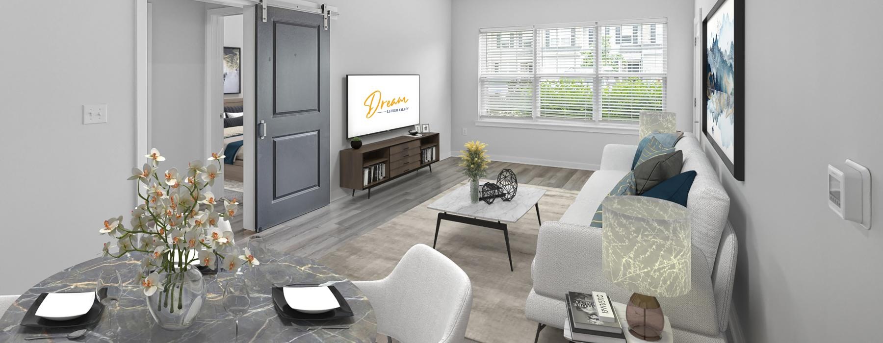a living room with a tv and couches