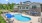 pool with reclining seating near the property