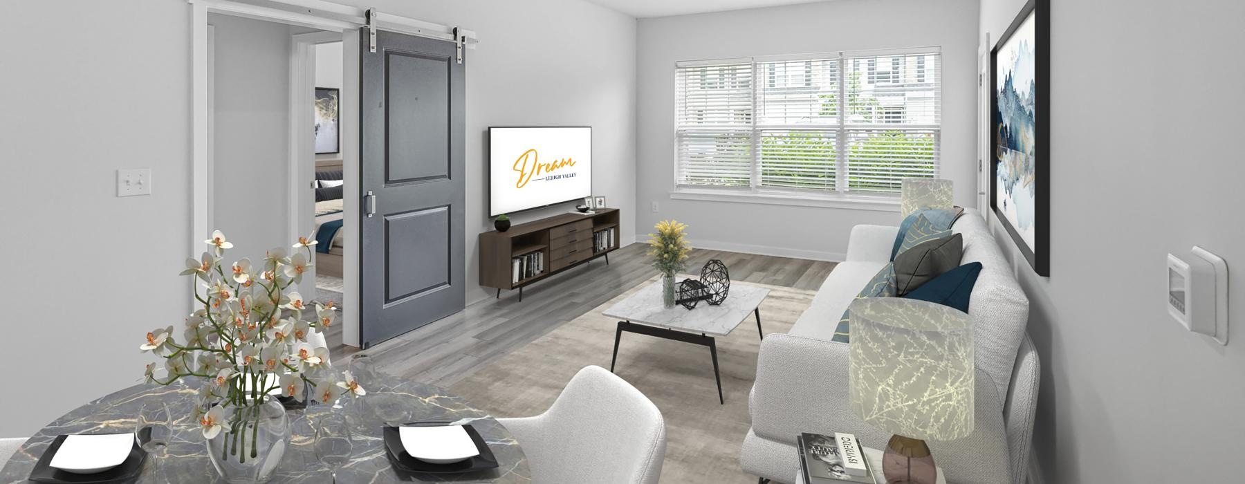 a living room with a tv and couches
