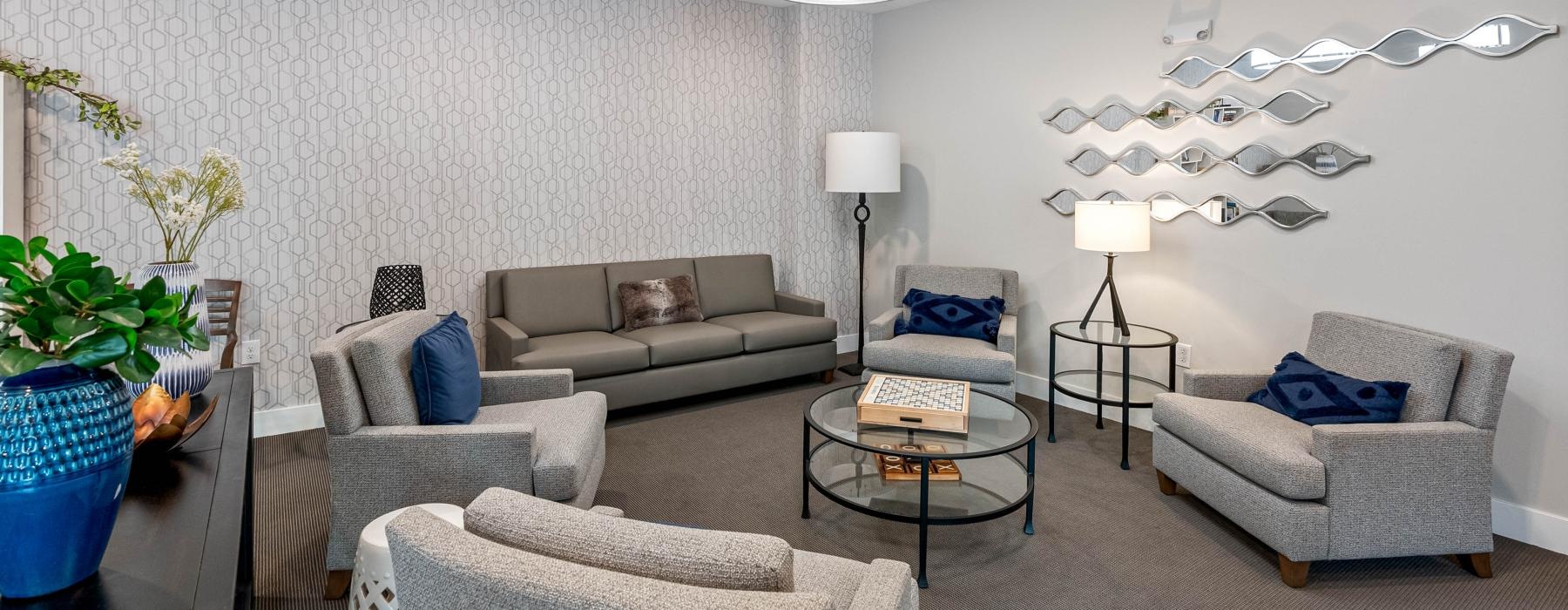 a living room with a couch and chairs