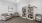 a room with a bookcase and chairs